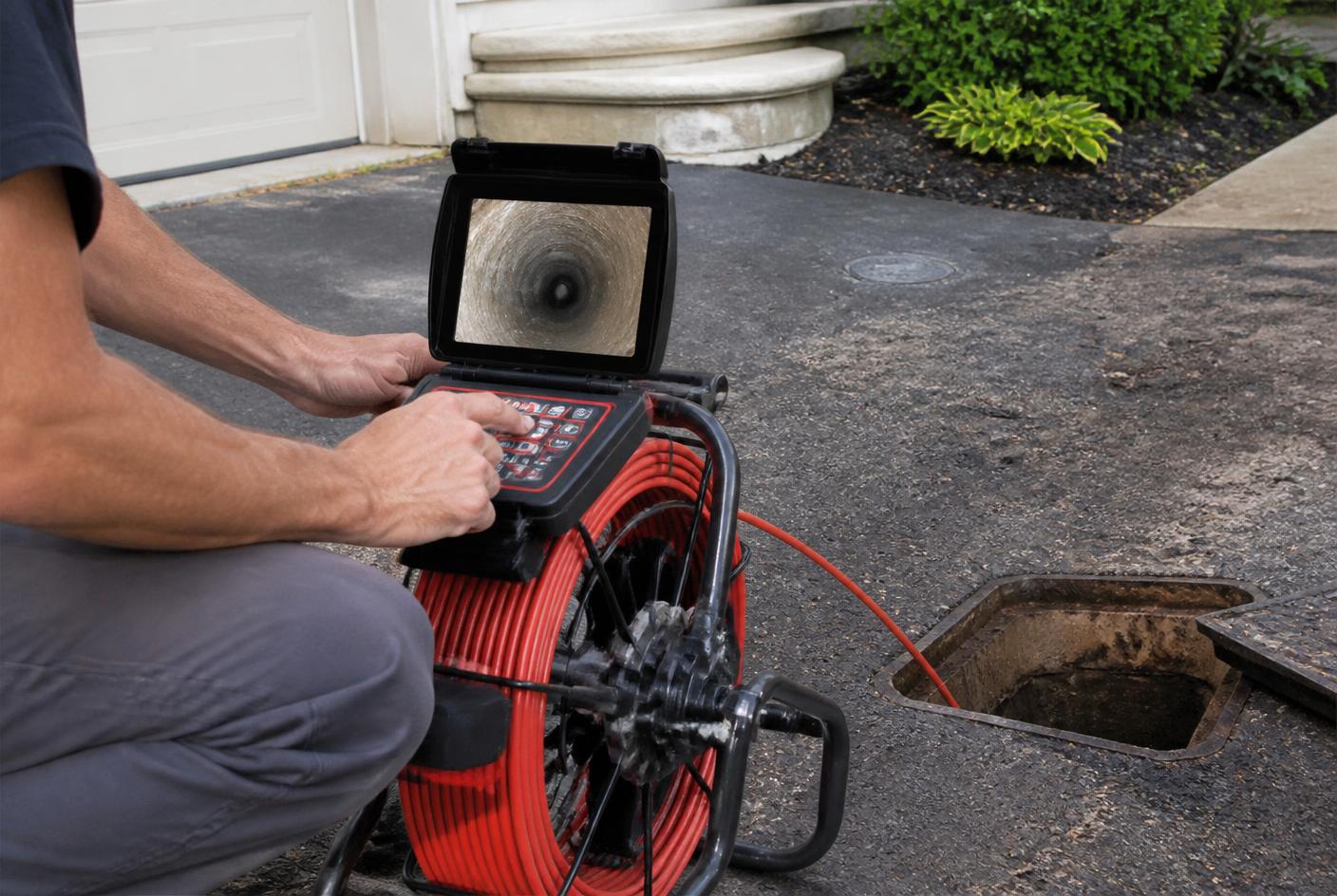 Sewer inspection camera equipment set up at a residential access point